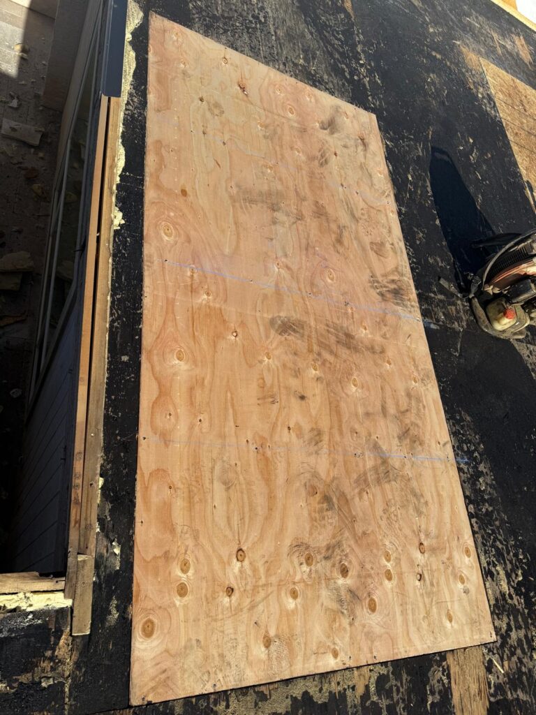 New plywood roof decking sheet installed during a roof repair, Tip Top Roofing Service