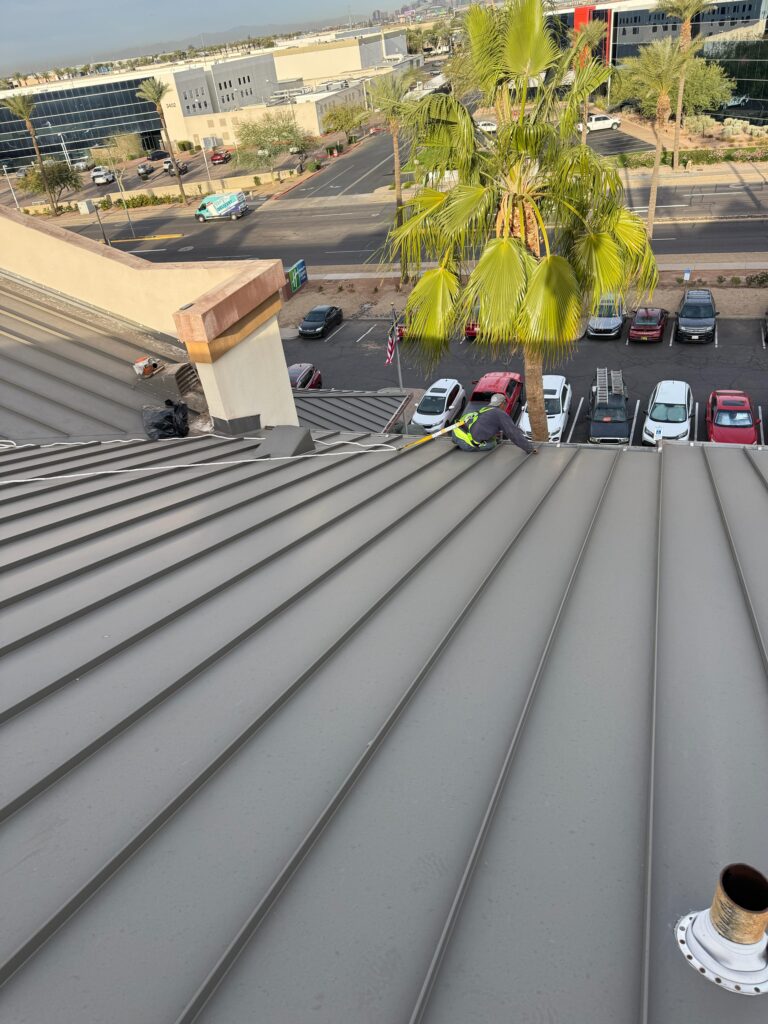 Standing seam metal roof panels on a commercial building, Tip Top Roofing Service