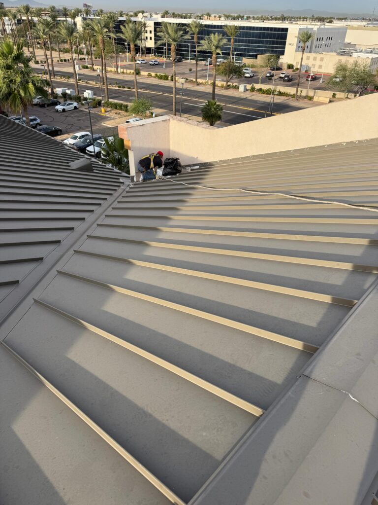 Standing seam metal roof on a commercial building, Tip Top Roofing Service